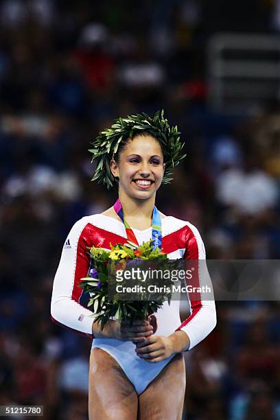 Courtney Kupets of the USA wins bronze in the women's artistic gymnastics uneven bar finals on August 22, 2004 during the Athens 2004 Summer Olympic...