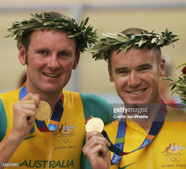 Graeme Brown and Stuart O'Grady of Australia receives the gold medal in the men's track cycling madison event on August 25, 2004 during the Athens...