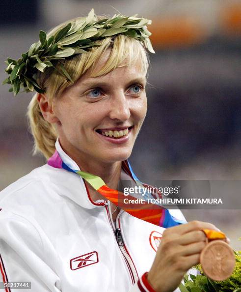 Rogowska Poland's Anna Rogowska celebrates with her bronze medal on the podium ...