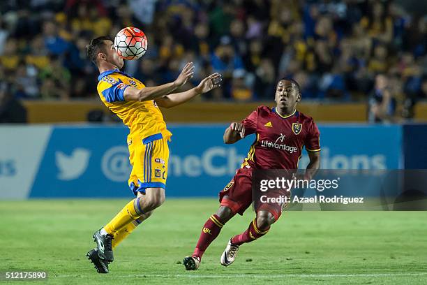 Israel Jimenez of Tigres receives the ball while observed by Joao Plata of Real Salt Lake during a quarterfinals first leg match between Tigres UANL...