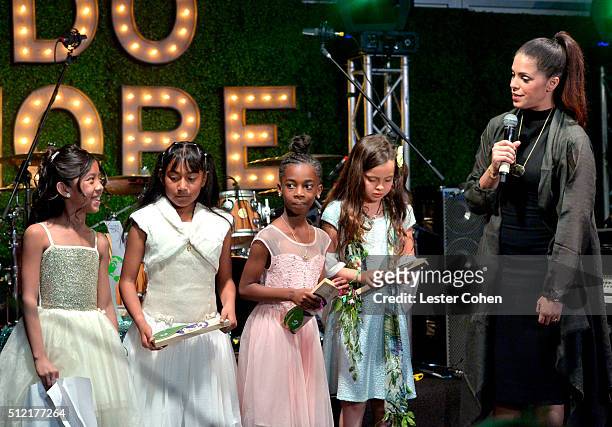 Global Green Champion Honorees Emma Leyson, Nereida Chavez, Jazzmyn Stallworth and Olivia Gorcey accept awards from tv personality Soledad O'Brien...