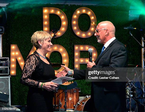 Senior communications officer of the World Bank Lucia Grenna accepts award from president & CEO, Global Green USA Les McCabe onstage during Global...