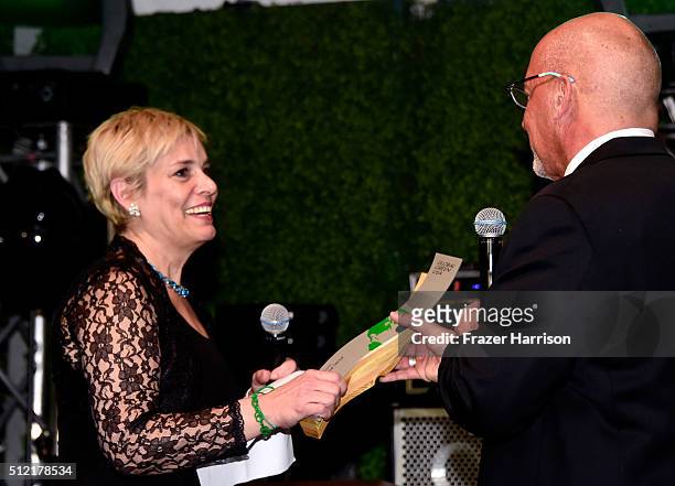 Senior communications officer of the World Bank Lucia Grenna accepts award from president & CEO, Global Green USA Les McCabe onstage during Global...