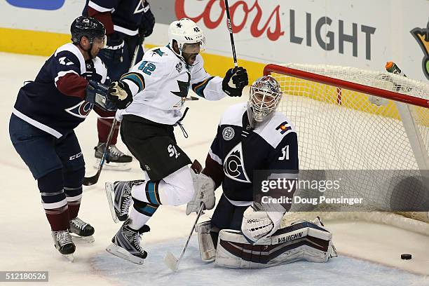 Joel Ward of the San Jose Sharks celebrates as he beats Francois Beauchemin of the Colorado Avalanche and scores a goal against goalie Calvin Pickard...