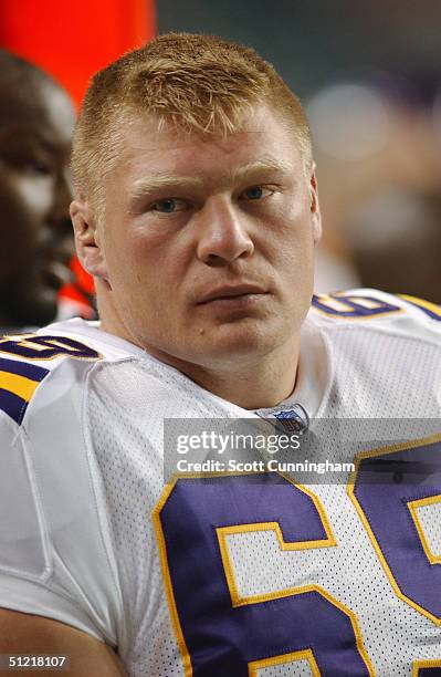 Brock Lesnar of the Minnesota Vikings looks on from the sideline against the Atlanta Falcons during the preseason NFL game on August 20, 2004 at The...