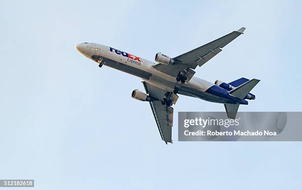 Fedex plane taking off in blue sky. FedEx Corporation is an American global courier delivery services company headquartered in Memphis, Tennessee.