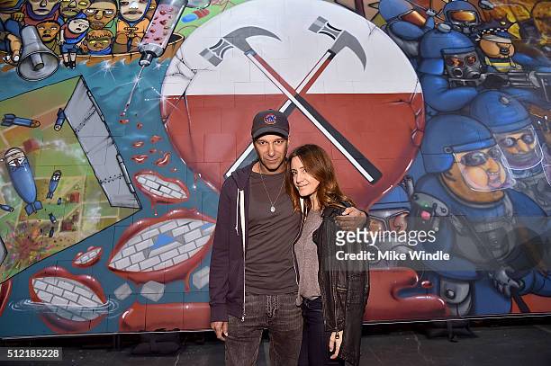 Musician Tom Morello and Denise Luiso attend in celebration of the release of the Limited Edition box set of the film "Roger Waters The Wall", Roger...