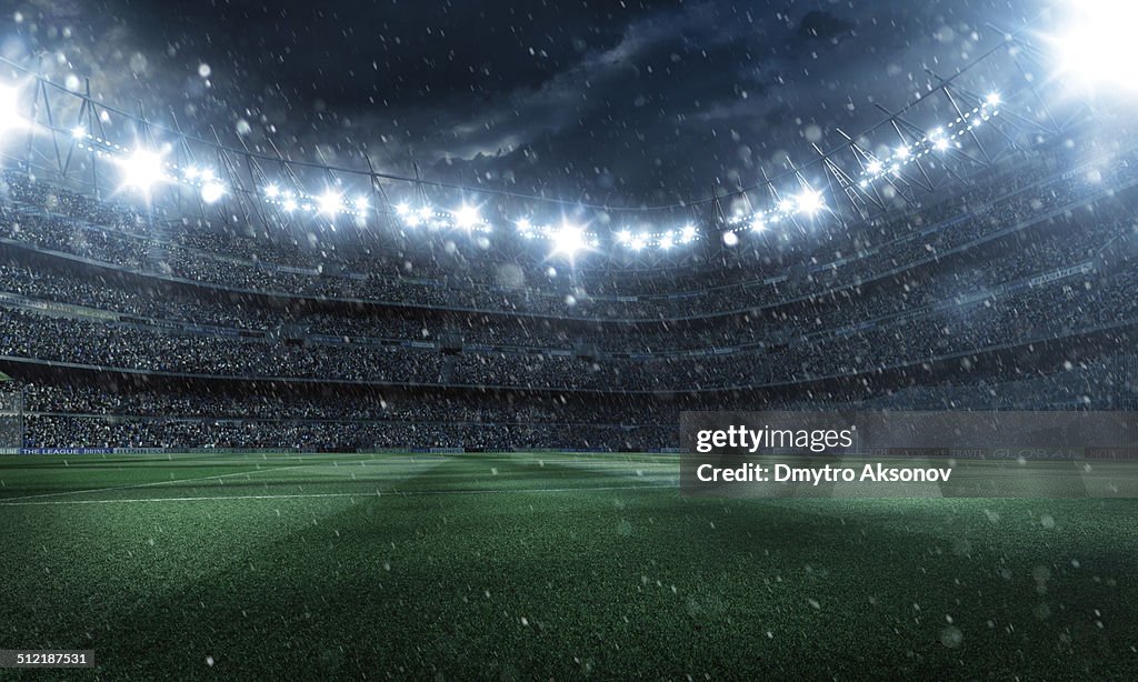 Dramatic football stadium with rain