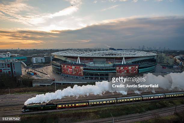 The Flying Scotsman passes the Emirates Stadium on the East Coast Mainline in Holloway on February 25, 2016 in London, England. The majestic steam...