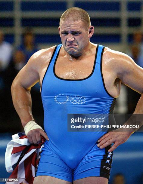 Rulon Gardner reacts after winning the men's Greco-Roman 120 kg bronze medal match against Iran's Sajad Barzi at the 2004 Olympic games 25 August...