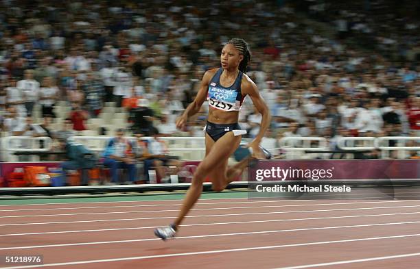 Allyson Felix of USA competes in the women's 400 metre hurdle final on August 25, 2004 during the Athens 2004 Summer Olympic Games at the Olympic...