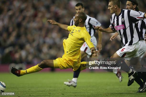 Freddie Kanoute of Spurs is challenged by Darren Purse of West Brom during the Barclays Premiership match between West Bromwich Albion and Newcastle...