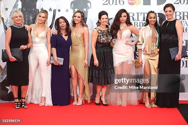 Perrie Edwards, Jade Thirlwall, Jesy Nelson and Leigh-Anne Pinnock from Little Mix with their mothers attend the BRIT Awards 2016 at The O2 Arena on...