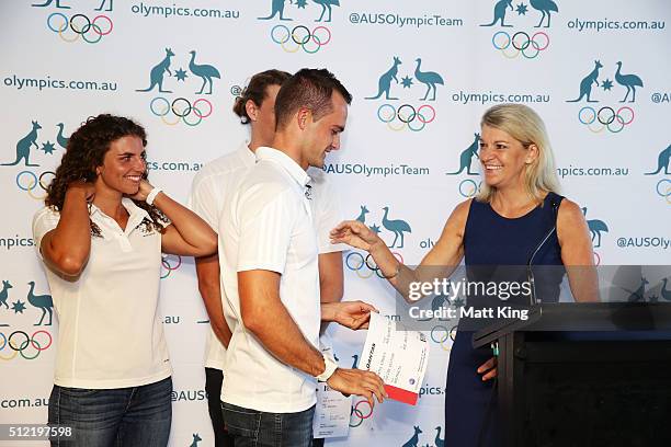 Chef de Mission for Australia at the 2016 Summer Olympics Kitty Chiller presents Lucien Delfour with his Qantas boarding pass to Rio during the...