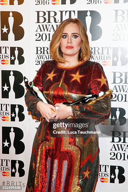 Adele poses in the winners room at the BRIT Awards 2016 at The O2 Arena on February 24, 2016 in London, England.