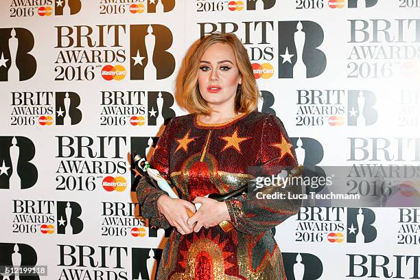Adele poses in the winners room at the BRIT Awards 2016 at The O2 Arena on February 24, 2016 in London, England.