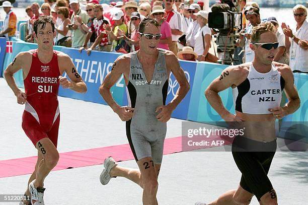 Switzerland's bronze medallist Sven Riederer, New Zealand's silver medallist Bevan Docherty and New Zealand's gold medallist Hamish Carter competes...