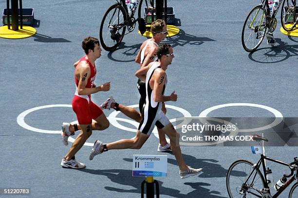 New Zealand's Hamish Carter , his compatriot Bevan Docherty and Switzerland's Sven Riederer run during the men's triathlon at the 2004 Olympic Games,...