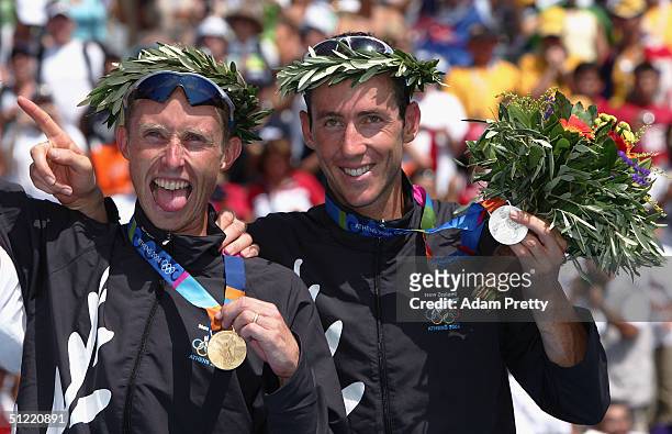 Hamish Carter and Bevan Docherty of New Zealand celebrate after winning the gold and silver medals in the men's triathlon on August 26, 2004 during...