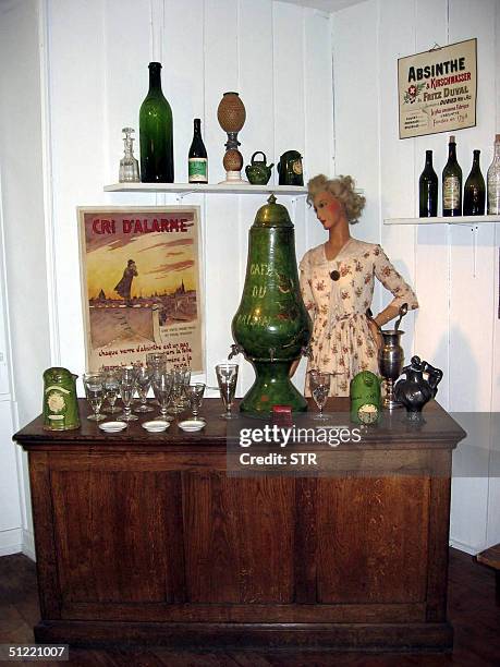 Picture taken 19 August 2004 shows a still used by clandestine producers in the Val-de-Travers and water urn exhibited in the absinthe museum in...