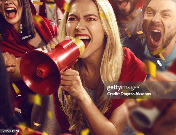 sport fans: girl is shouting in megaphone - cricket stadium stock pictures, royalty-free photos & images