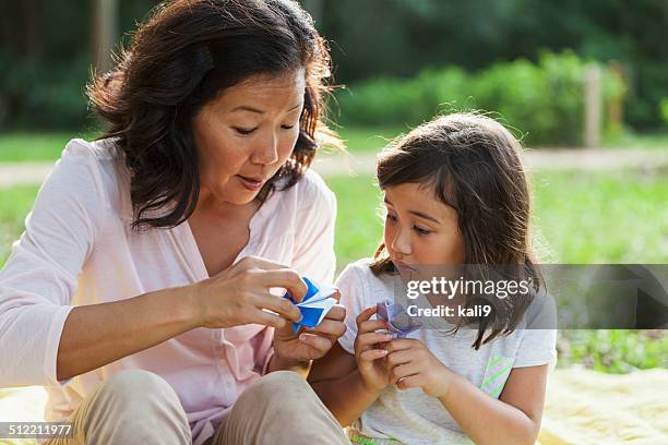 japanese mother and daughter - origami instructions stock pictures, royalty-free photos & images