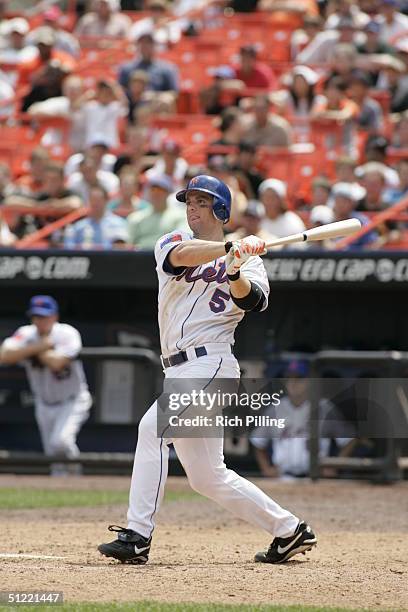 Infielder David Wright of the New York Mets swings at a Houston Astros pitch during the game at Shea Stadium on August 12, 2004 in Flushing, New...