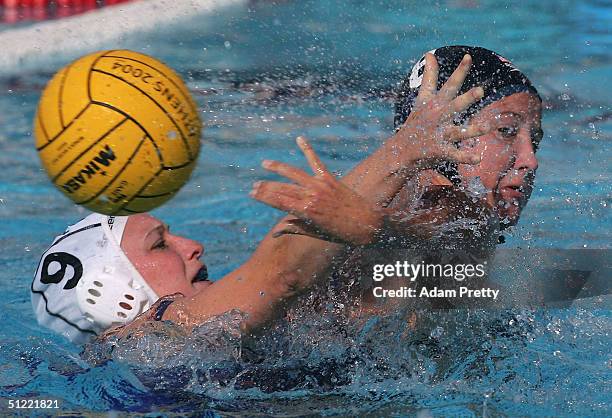 Kelly Rulon of the USA makes a backhand shot passed Elise Norwood of Australia in the women's Water Polo bronze medal game on August 26, 2004 during...