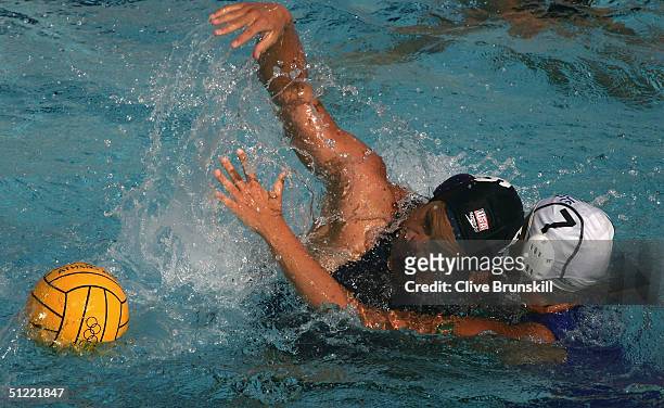 Natalie Golda of the USA and of Jodie Stuhmcke Australia contest the ball in the women's Water Polo bronze medal game on August 26, 2004 during the...
