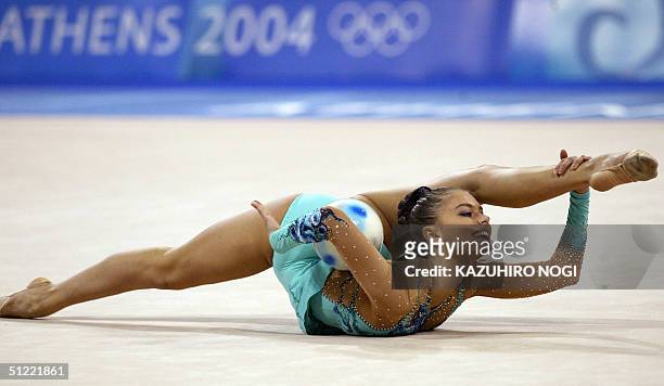 Alina Kabaeva of Russia performs with a ball at the gymnastics rhythmic individual all-around qualification, 26 August 2004, at the Galatsi Olympic...
