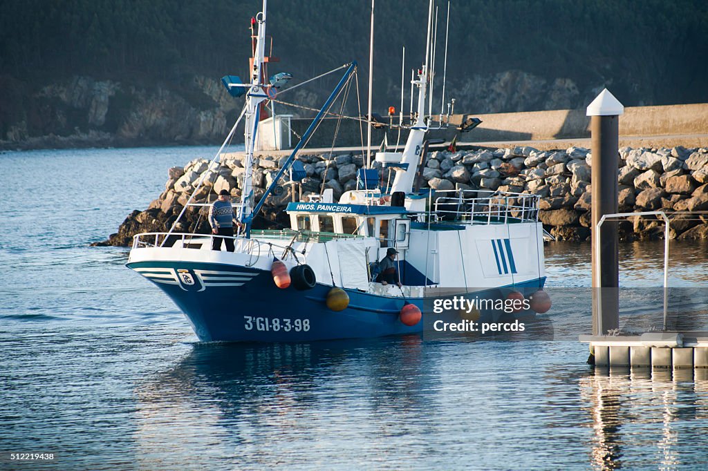 Fishing boat entering Vicedo harbor,  Galicia, Spain