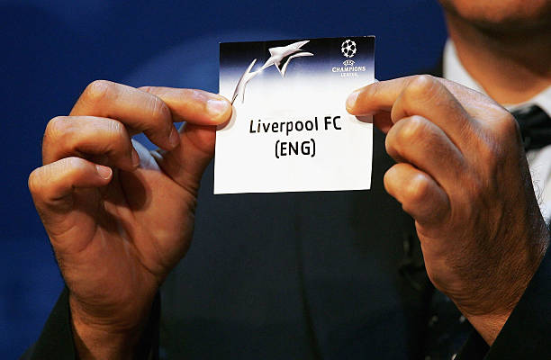 Michel Platini draws out Liverpool during the UEFA Champions League Draw for the first stage of the Season 2004/05 at the Grimaldi Forum on August...