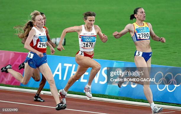 Romania's Maria Cioncan, Poland's Anna Jakubczak and Russia's Tatyana Tomashova compete in the women's 1,500m semfinals at the Olympic Stadium 26...