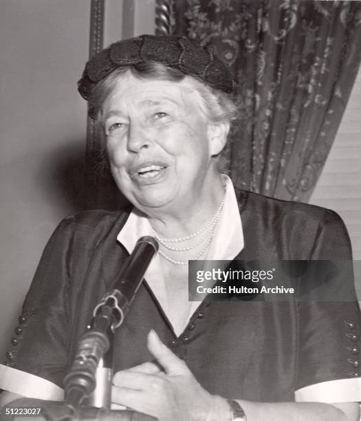 American diplomat and former First Lady Eleanor Roosevelt speaks from behind a microphone, 1950s.