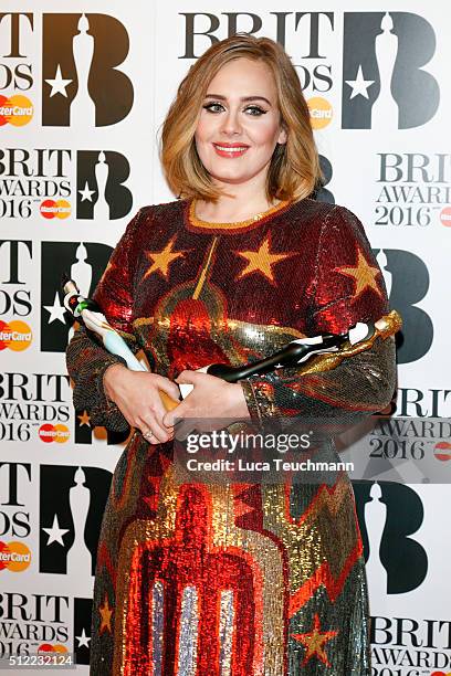 Adele poses in the winners room at the BRIT Awards 2016 at The O2 Arena on February 24, 2016 in London, England.