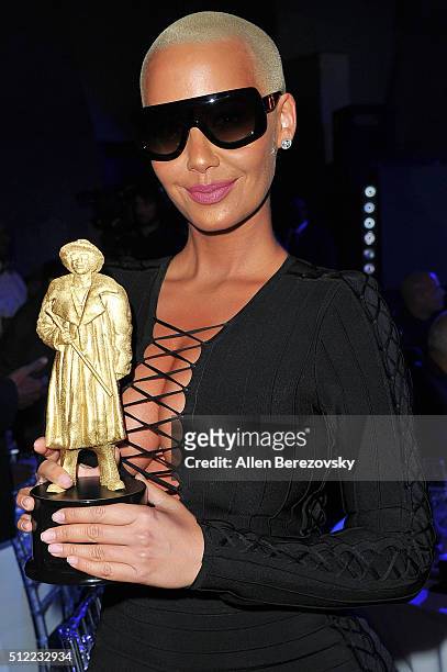 Actress Amber Rose, winner of the Most Likely to Steal Your Girl Award, poses with her trophy during the All Def Movie Awards at Lure Nightclub on...