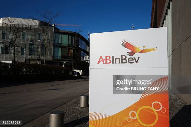 Picture taken on February 25, 2016 shows the AB INBEV logo at the entrance of the offices ahead of a press conference on the 2015 year results of...