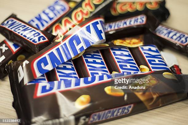 Snickers chocolate bars are seen on a table in Ankara, Turkey on February 25, 2016. American candy maker Mars announced Tuesday that it was recalling...