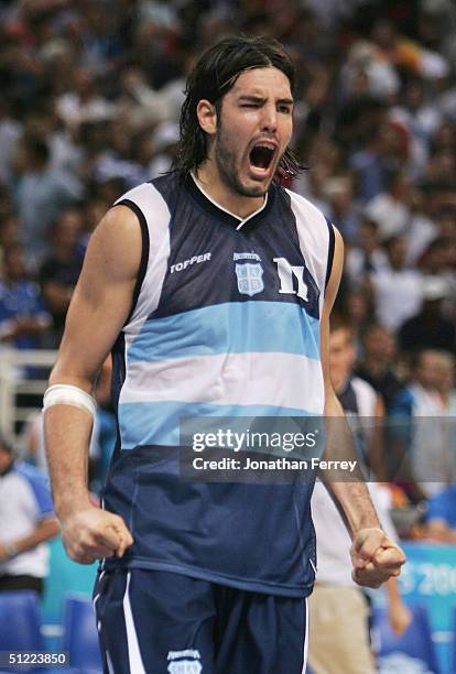 Luis Scola of Argentina celebrates defeating Greece in the men's basketball quarterfinal game on August 26, 2004 during the Athens 2004 Summer...