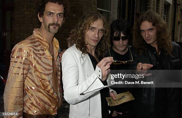 The Darkness and their front man Justin Hawkins arrive at the 11th annual "Kerrang Awards 2004" at The Brewery, East London on August 26, 2004 in...