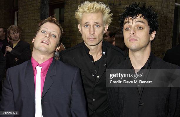 Tre Cool, Mike Dirnt, Billie Joe Armstrong from the band Green Day arrive at the 11th annual "Kerrang Awards 2004" at The Brewery, East London on...