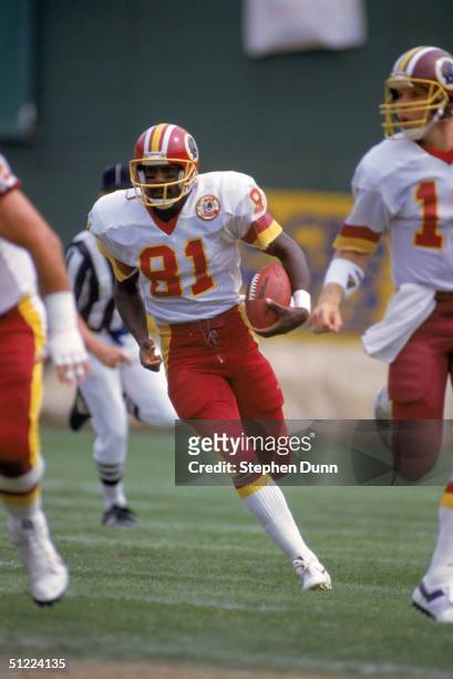 Wide receiver Art Monk of the Washington Redskins runs for yards during a 1986 NFL season game.