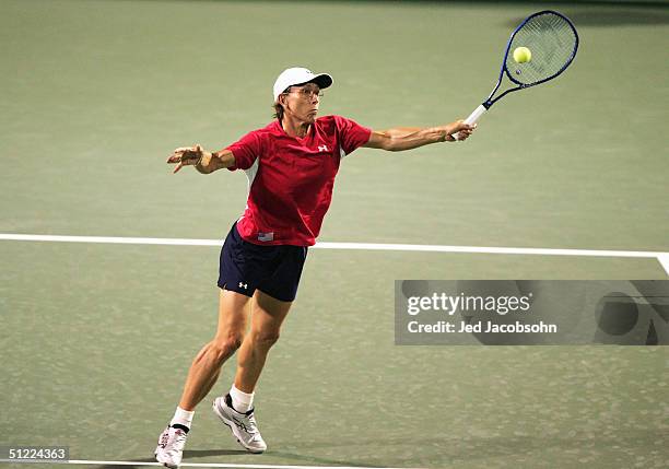 Martina Navratilova returns a shot against Marta Marrero of Spain and Henrieta Nagyova of Slovakia during a doubles match at the Pilot Pen Tennis...