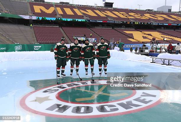 Ryan Carter, Mike Reilly, Matt Dumba and Nate Prosser of the Minnesota Wild stand in position at an auxiliary rink during practice for the 2016 Coors...