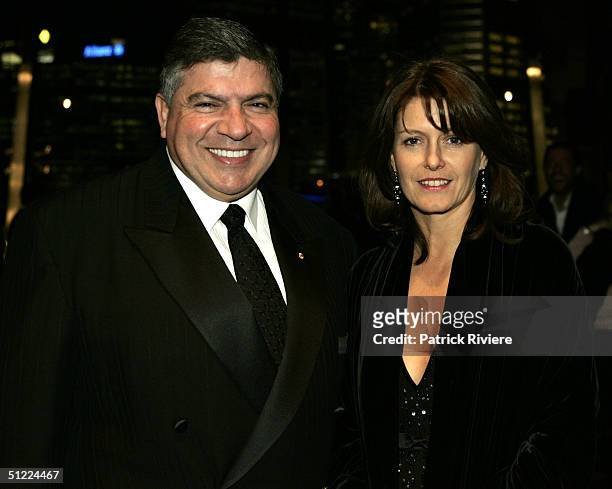 John Symond and friend attend the 'Jeans For Genes' Charity Ball at the Convention Center in Darling Harbour July 22, 2004 in Sydney, Australia.