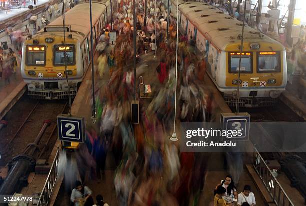 Indian commuters get off from trains at the Church Gate railway station in Mumbai, India on February 25, 2016. Railway Minister Suresh Prabhu...