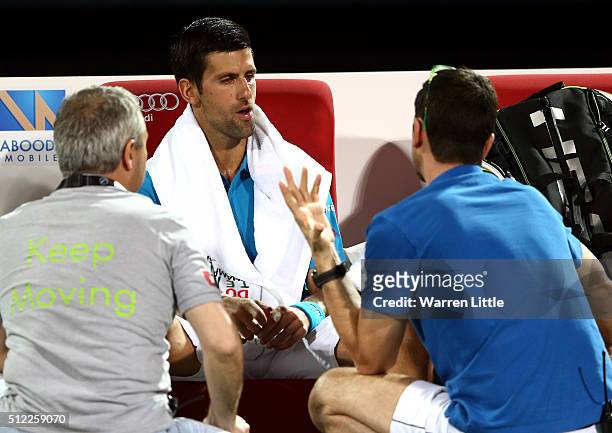 Novak Djokovic of Serbia receives medical attention on court during his quarter final match against Feliciano Lopez of Spain on day six of the ATP...