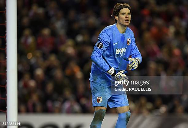 Augsburg's Swiss goalkeeper Marwin Hitz looks on during the UEFA Europa League round of 32, second leg football match between Liverpool and Augsburg...