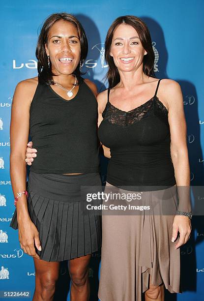 Former Olympic 400m Champion Cathy Freeman of Australia with Laureus Academy member Nadia Comaneci during the Laureus AIPS Spirit of Sport World...