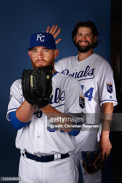 Pitcher Ian Kennedy of the Kansas City Royals poses for a portrait as Luke Hochevar steps in during spring training photo day at Surprise Stadium on...